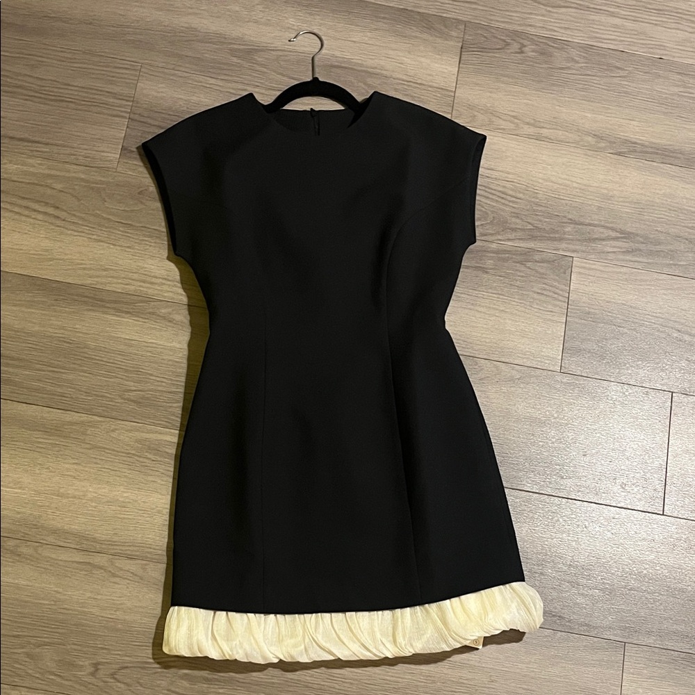 Elegant Black Dress with Cream Hem